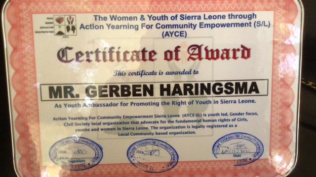 Certificate of award to Mr, Gerben Haringsma as youth ambassador for promoting the right of youth in Sierra Leone